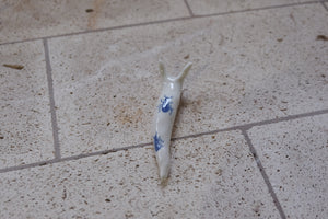 porcelain snail with ants on his back