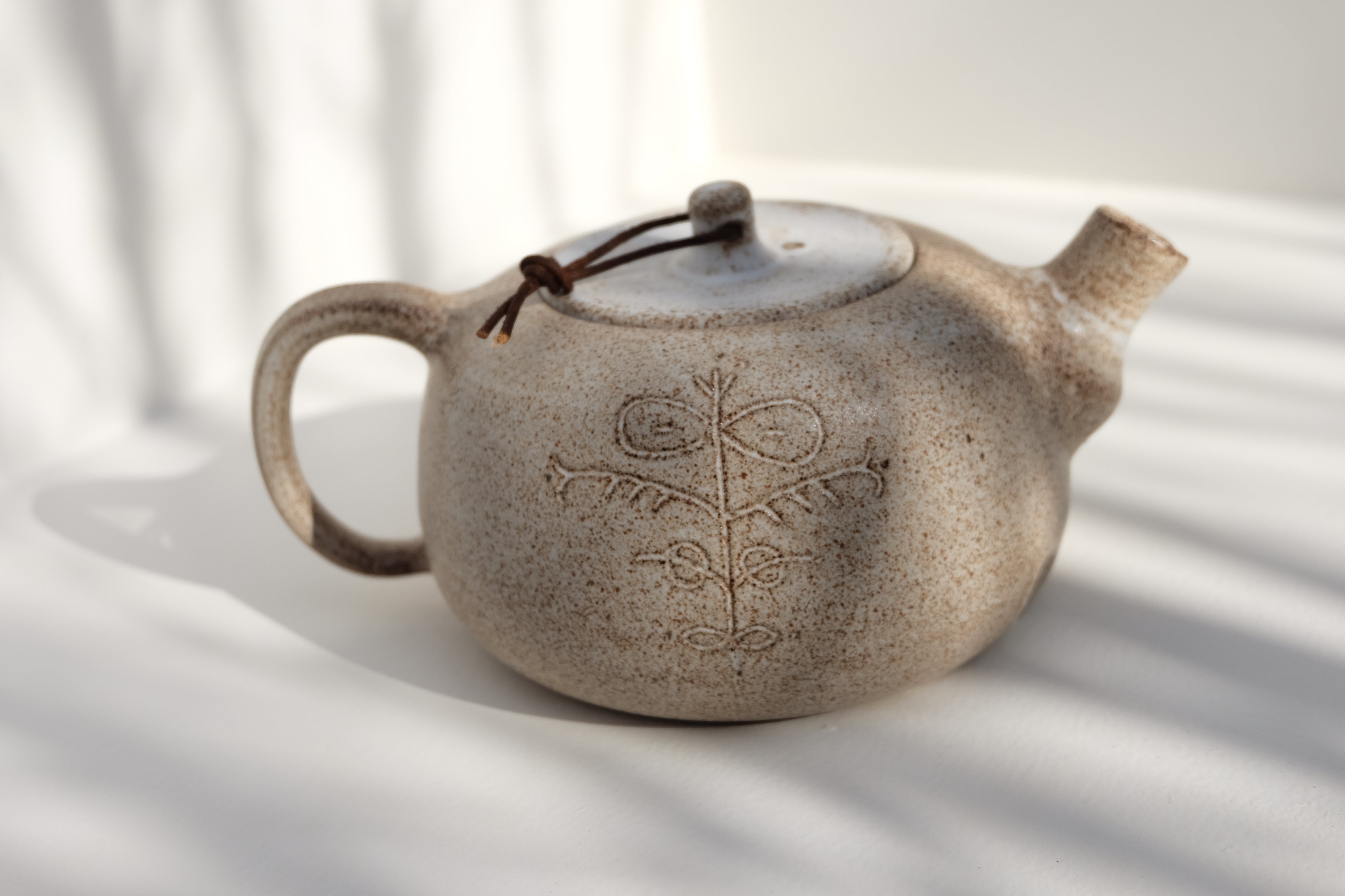 teapot with leather detail