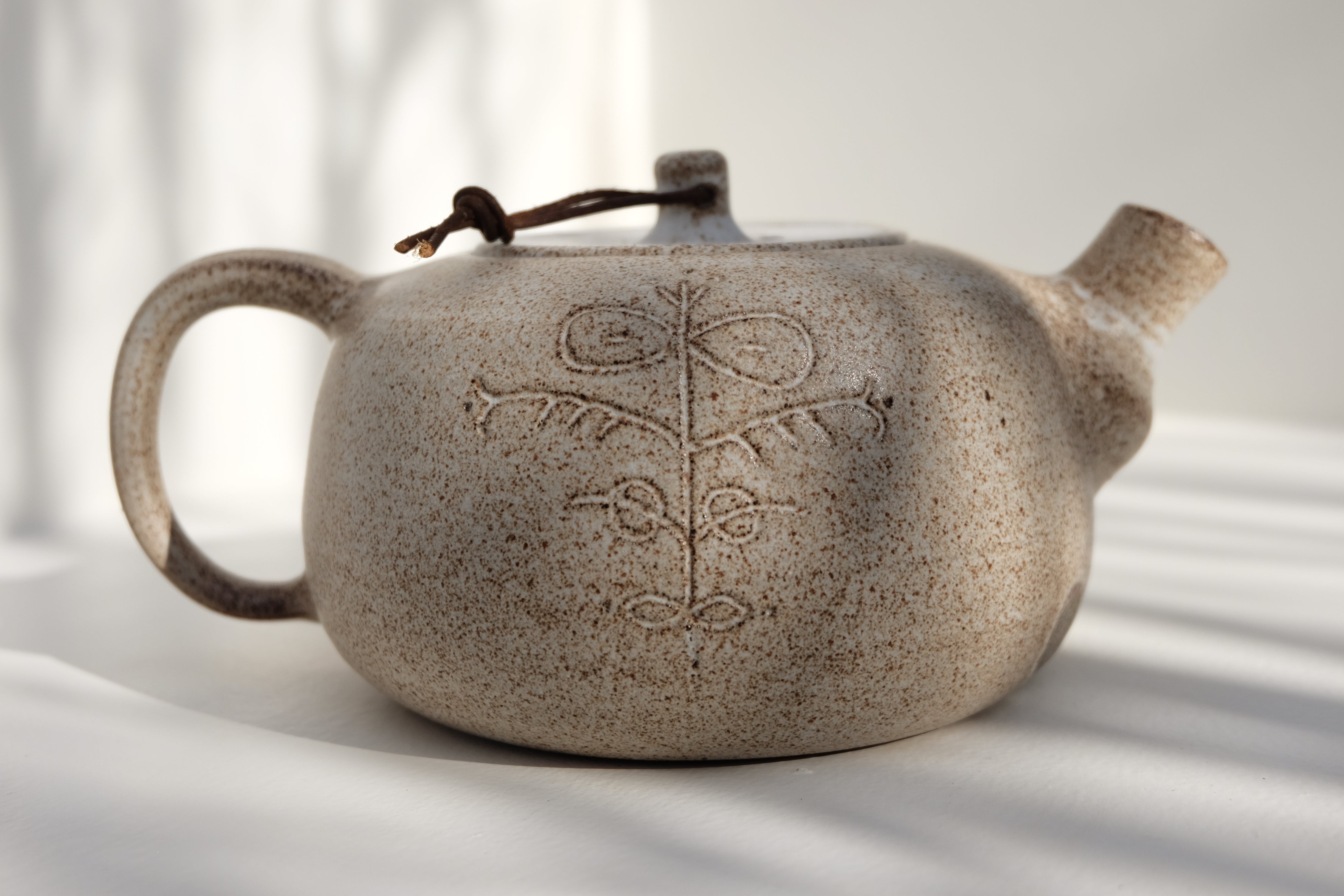 teapot with leather detail