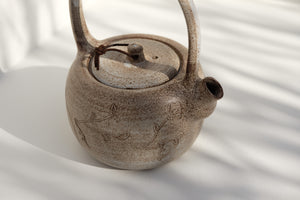 teapot with leather detail